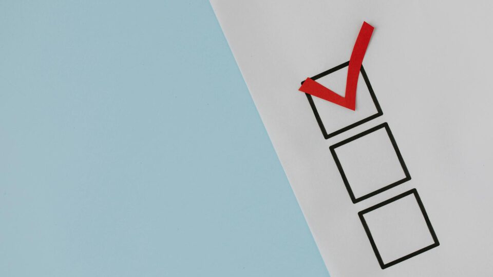 red check mark over black box
